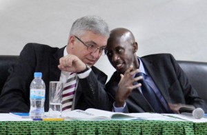 1413841372ministers-francis-kaboneka-r-and-roger-lewentz-chat-during-the-meeting-in-kigali-yesterday